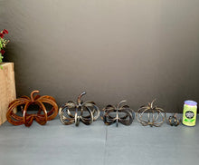 Load image into Gallery viewer, Pumpkins arranged by size (Left to right: Large Horseshoe Pumpkin (no longer available), Regular Horseshoe Pumpkin, Small/Pony Horseshoe Pumpkin, Rod Pumpkin, Horseshoe Nail Pumpkin, Can for scale)